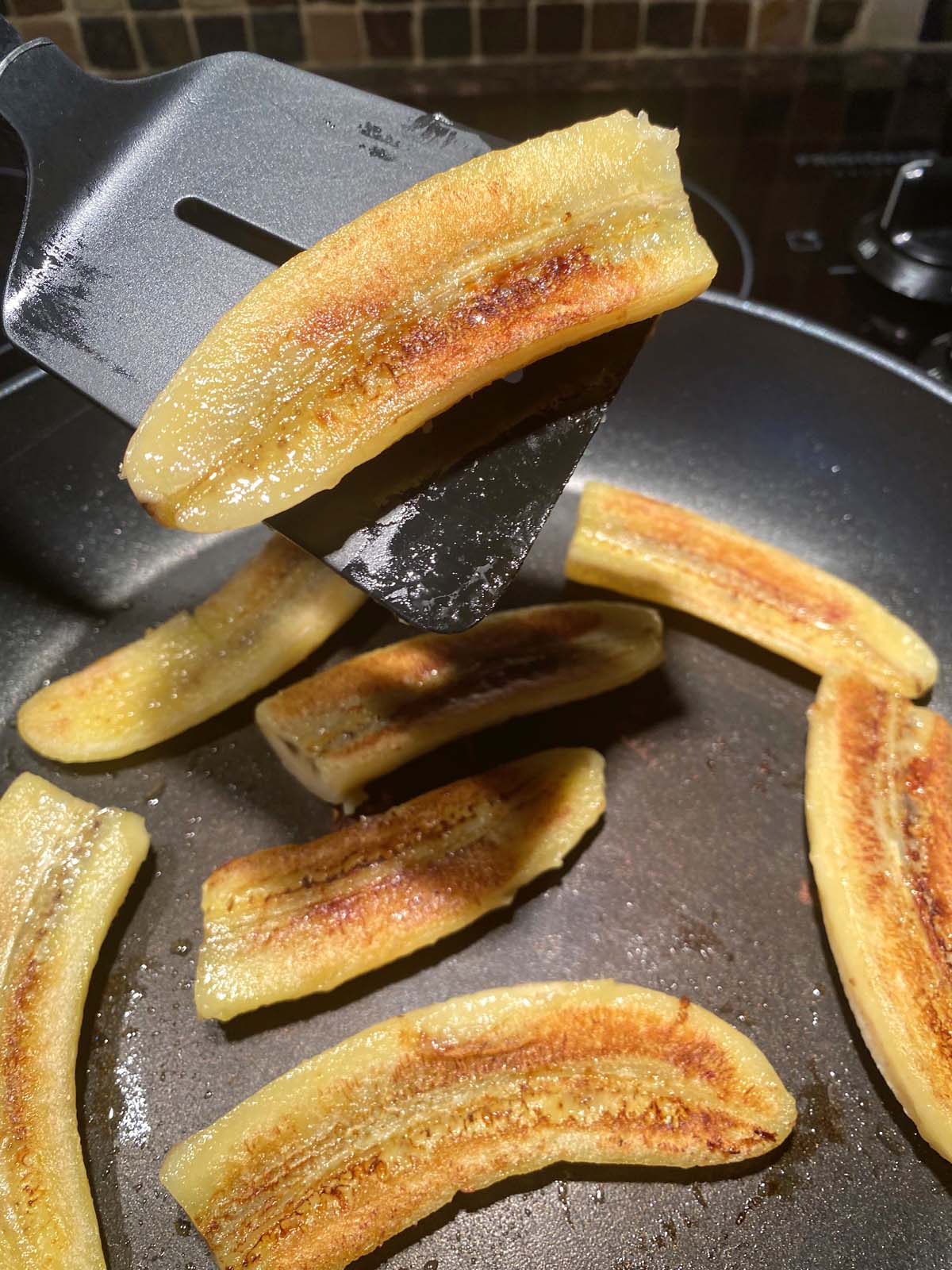 Fried bananas in a frying pan.