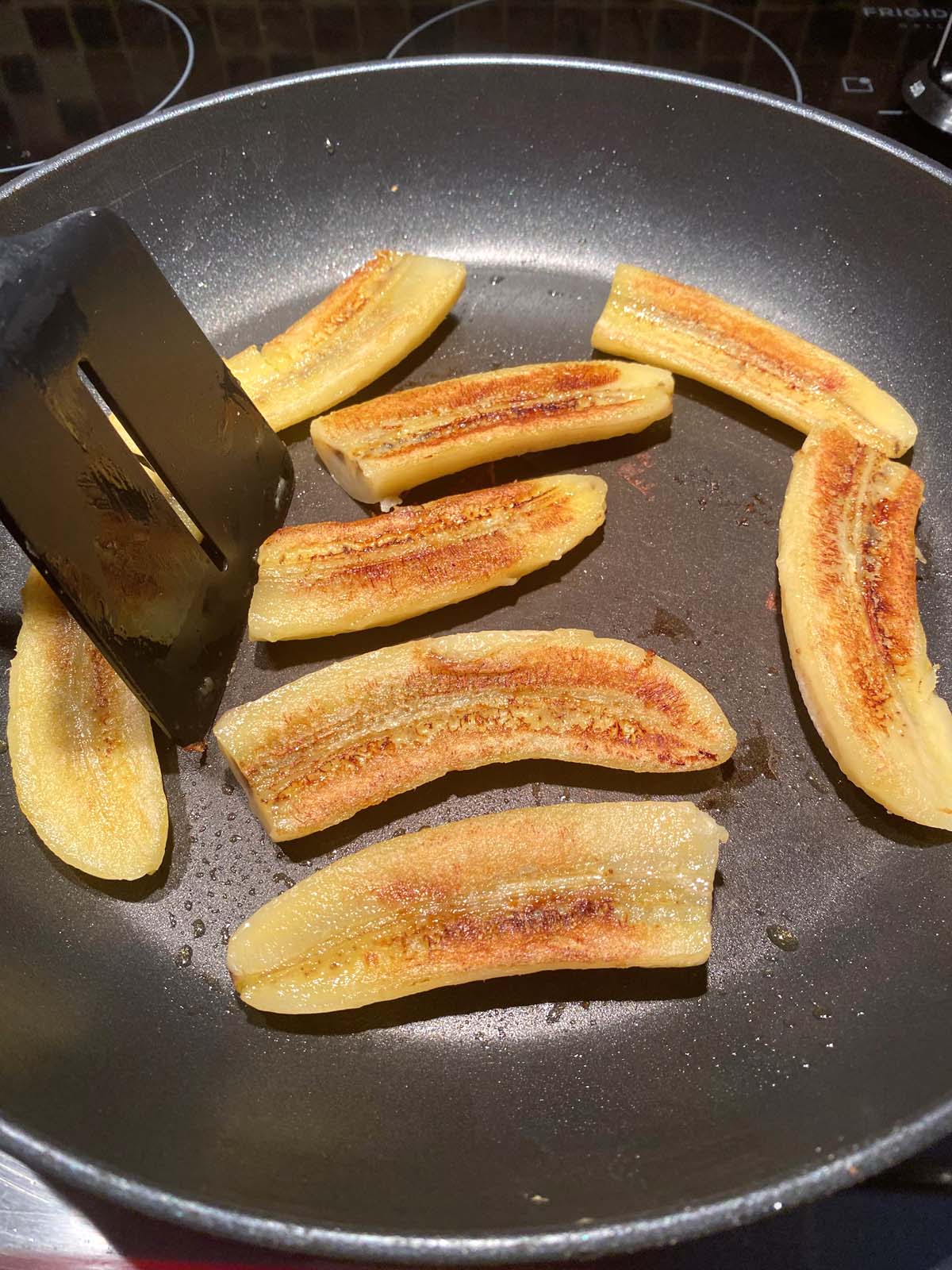 Fried bananas in a frying pan.
