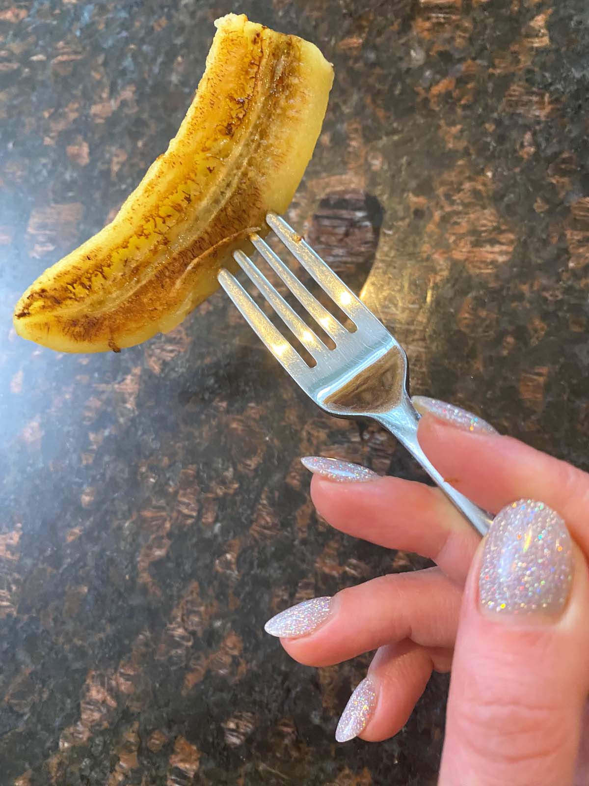 Fried banana on a fork.