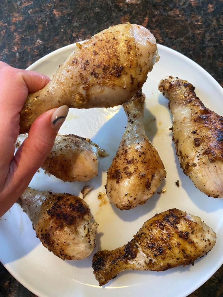 hand holding seasoned drumstick