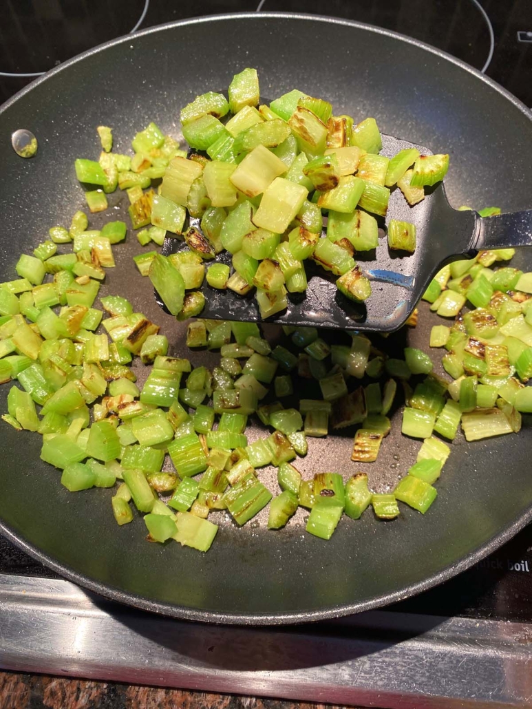 spatula scooping up Sauteed Celery