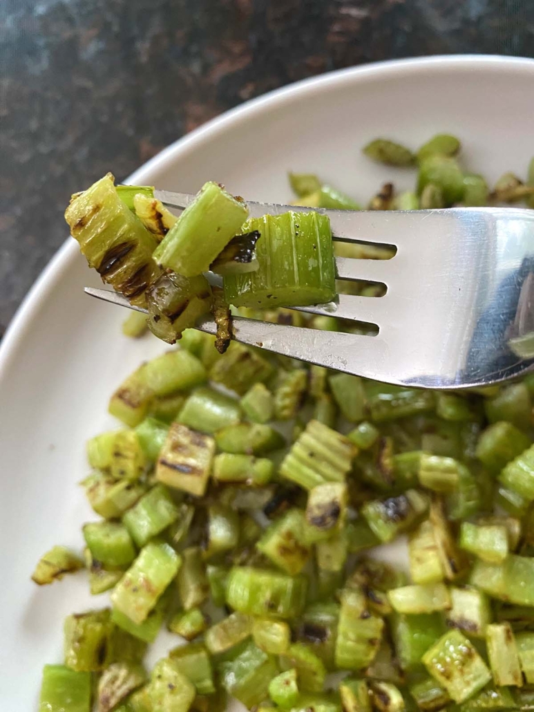 fork holding bite of Sauteed Celery