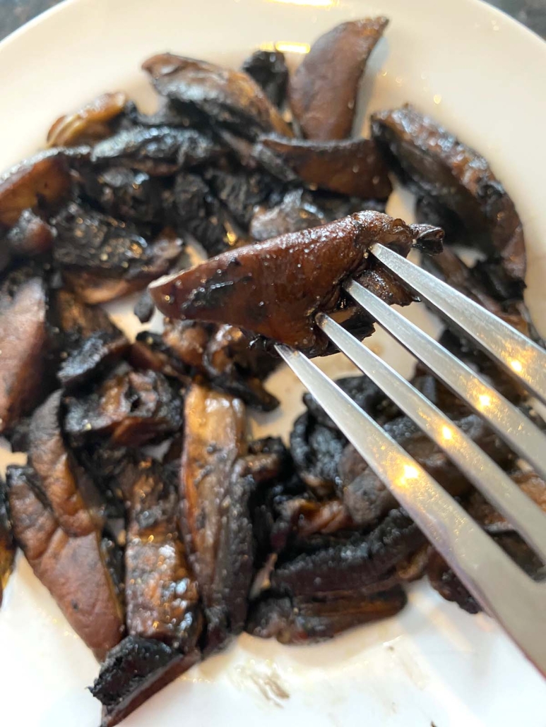 fork holding piece of portobello mushroom