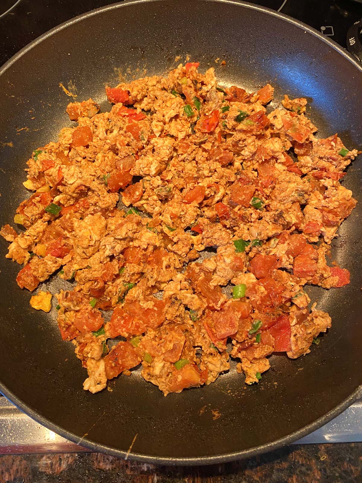 Chinese egg tomato stir fry in a skillet.