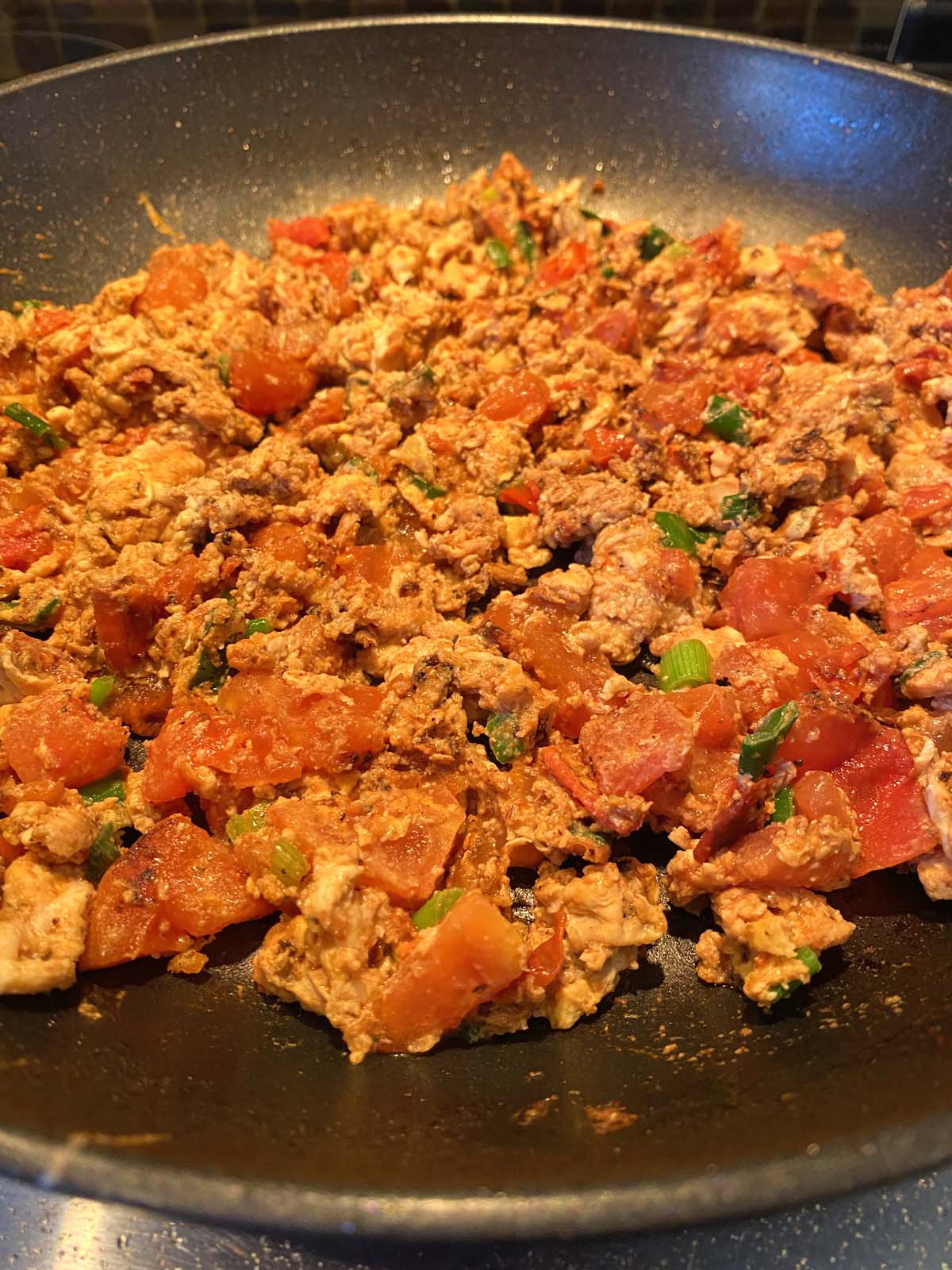 Chinese egg tomato stir fry in a skillet. 