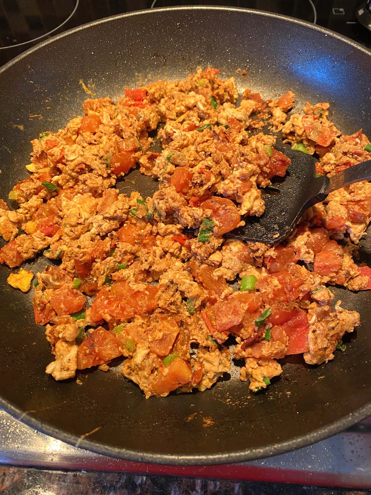 Chinese egg tomato stir fry in a skillet. 