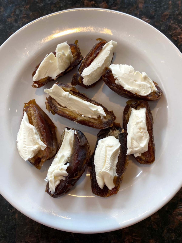 appetizer plate of Stuffed Dates With Cream Cheese