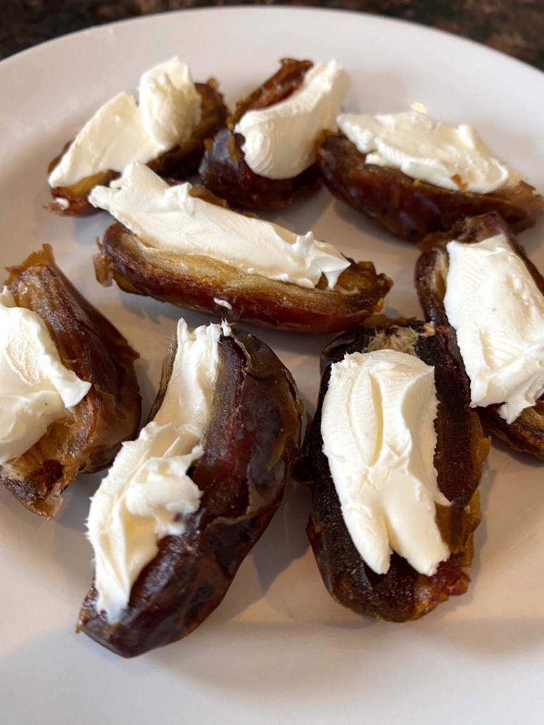 plate of Stuffed Dates With Cream Cheese 