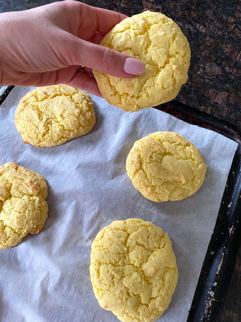 hand holding lemon cookie made with cake mix