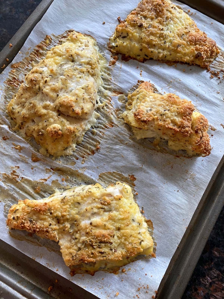 Parmesan Crusted Cod Fish on a baking sheet