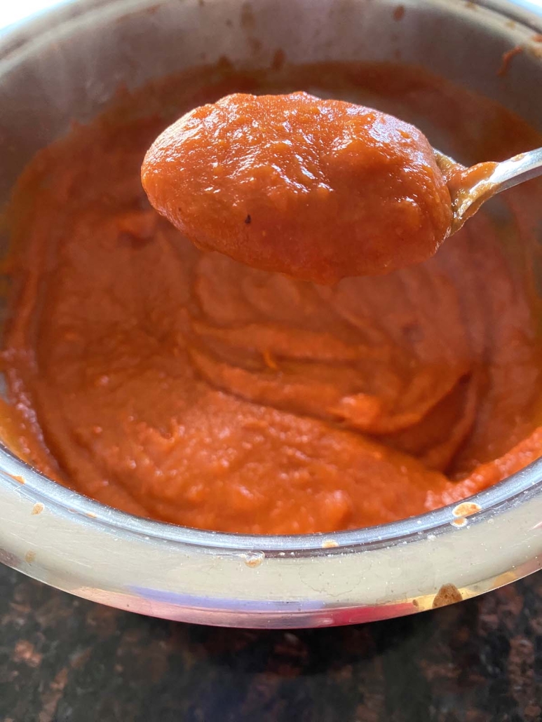 spoon of cooked Tomato Gravy