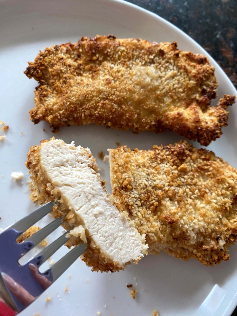 fork holding slice of panko chicken