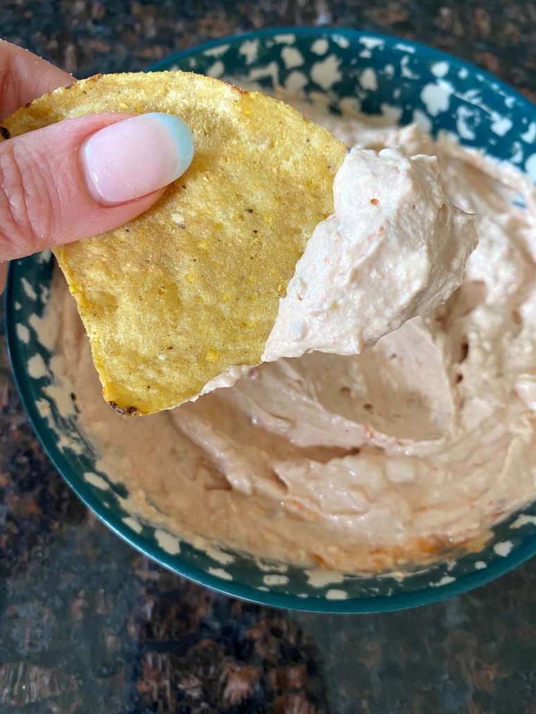 easy appetizer Cream Cheese And Salsa Dip on a tortilla chip