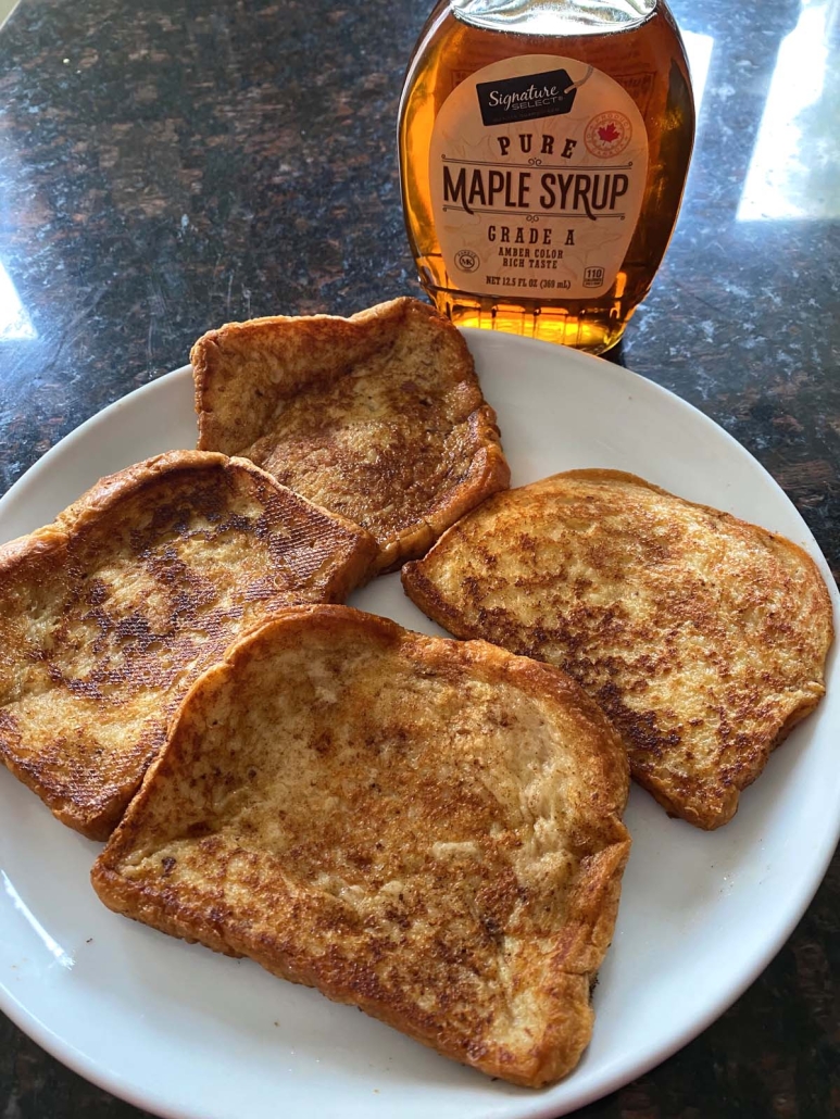 French Toast on a plate with maple syrup