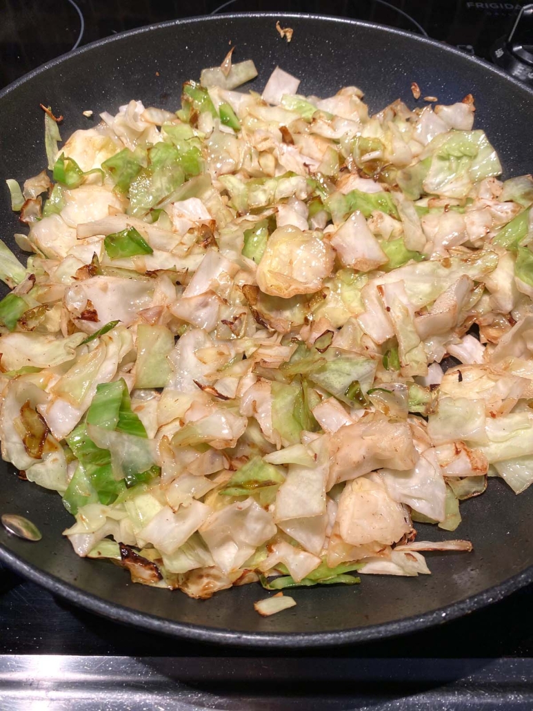 cabbage pan frying in a skillet