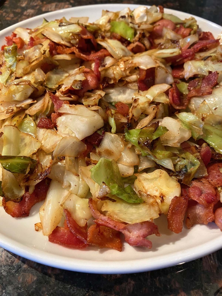 seasoned Fried Cabbage With Bacon on a serving plate