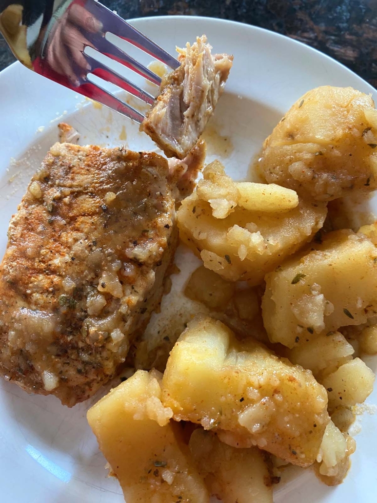 fork holding piece of pork cooked in the instant pot