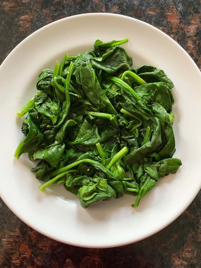 plate of steamed spinach