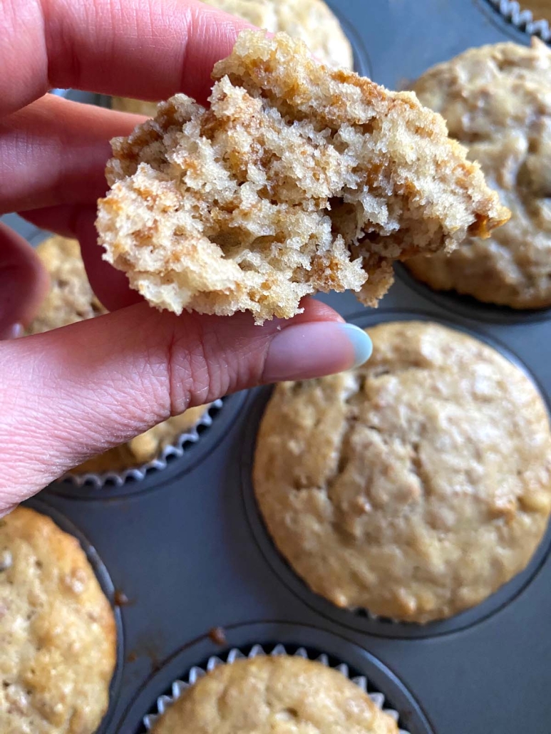 hand holding sliced Raisin Bran Muffin