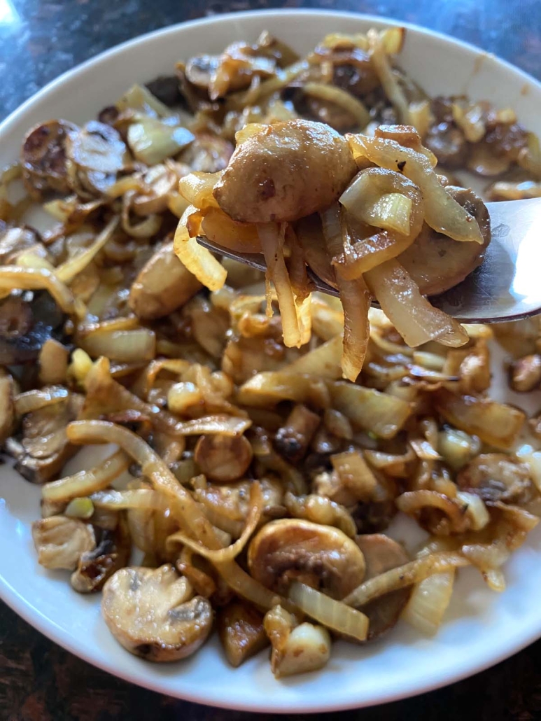 fork holding Sautéed Mushrooms And Onions