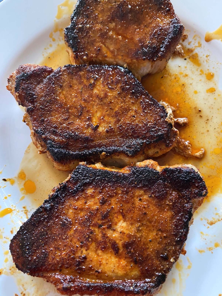 Sauteed Pork Chops on a plate with light gravy