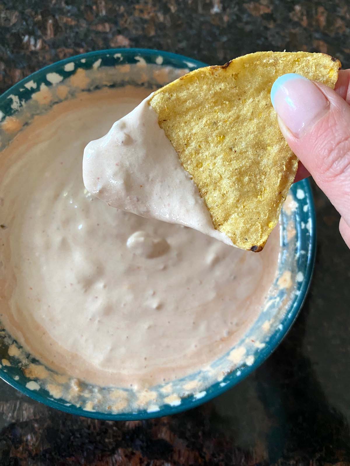 Bowl of sour cream and salsa dip.