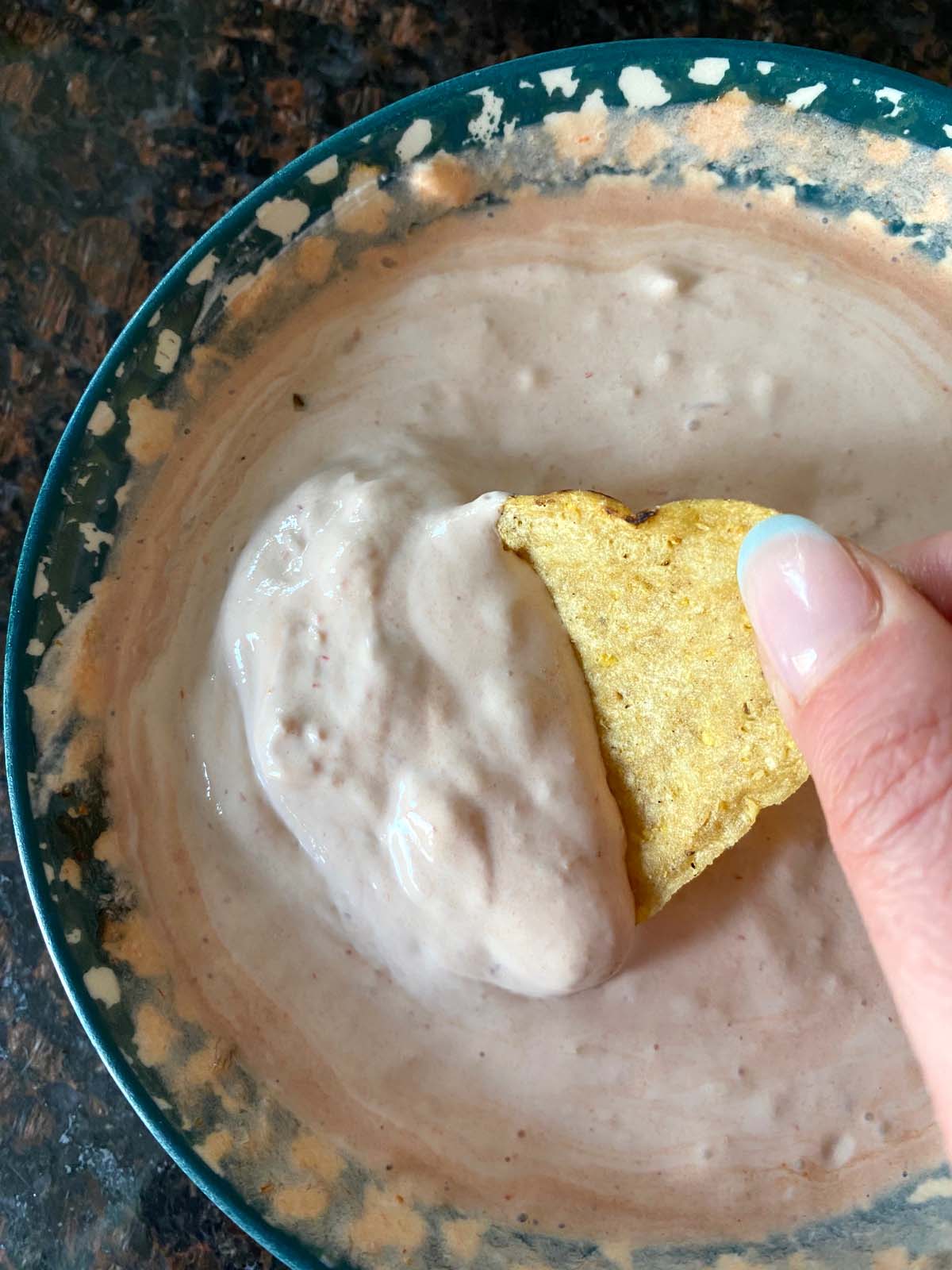 Bowl of sour cream and salsa dip.