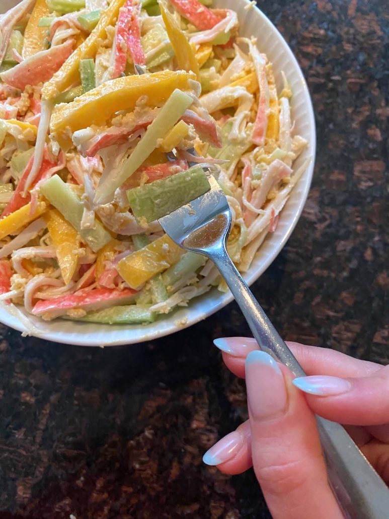 Spicy Kani Salad topped with sriracha and mayo dressing