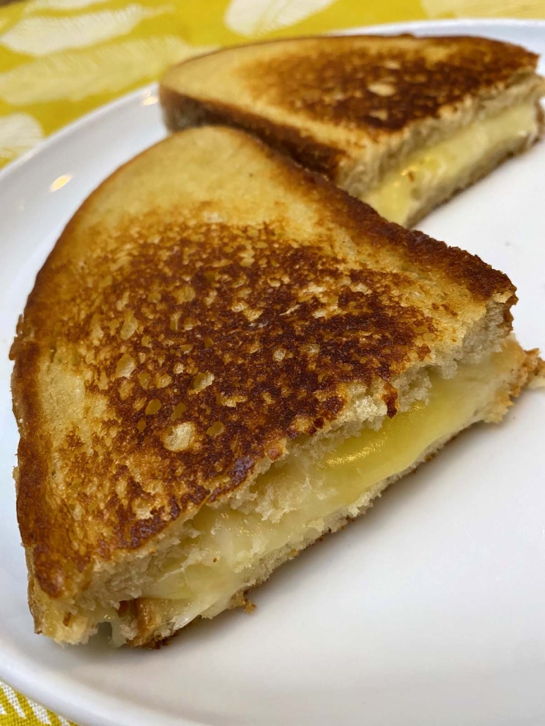 halves of the Starbucks Grilled Cheese Copycat sandwich on a plate