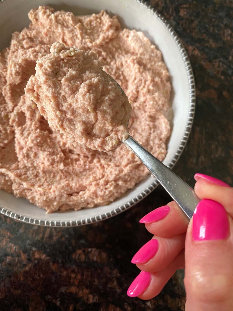 hand holding spoon with Bologna Salad