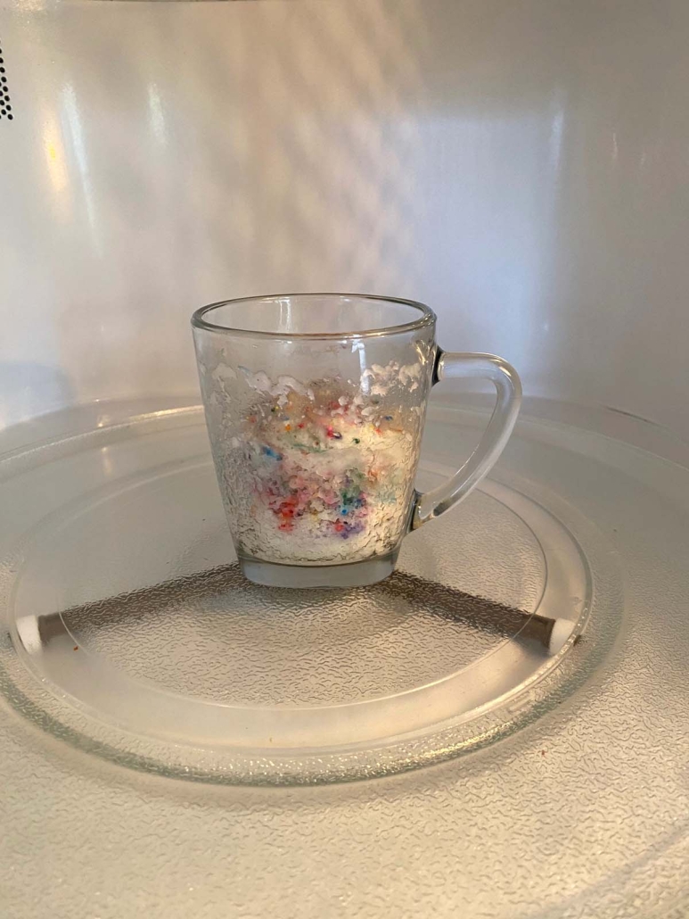 Cake Mix Mug Cake heating up in microwave