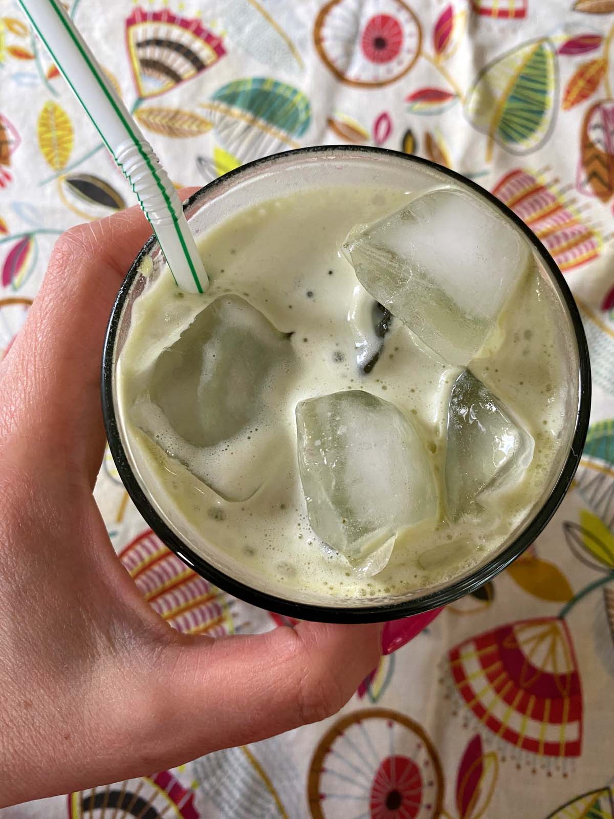 An iced matcha latte in a glass.