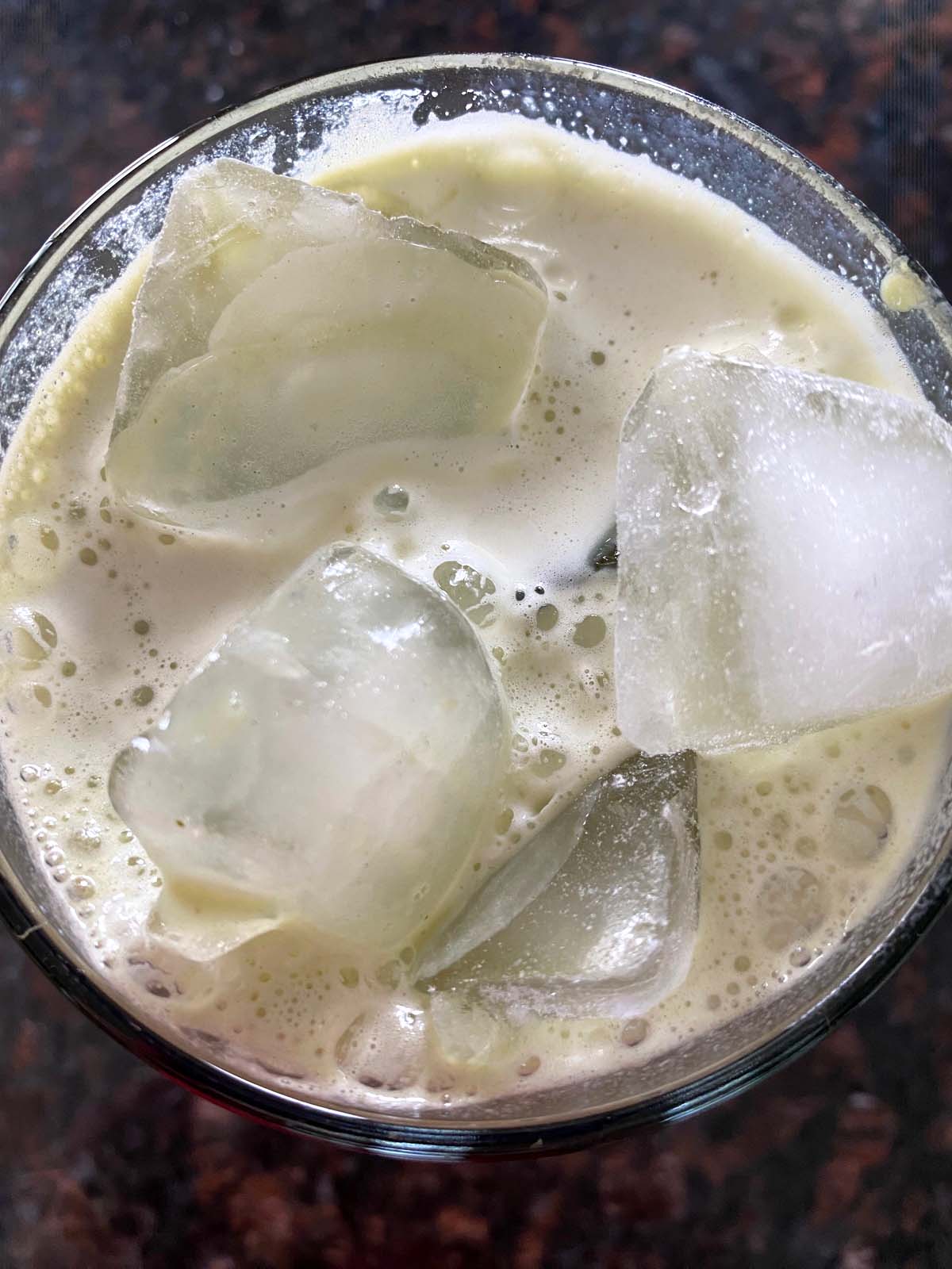 An iced matcha latte in a glass.