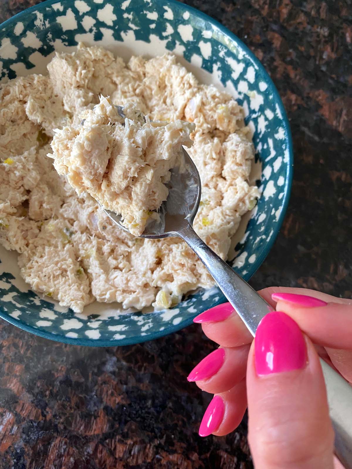 Shredded chicken salad in a bowl.