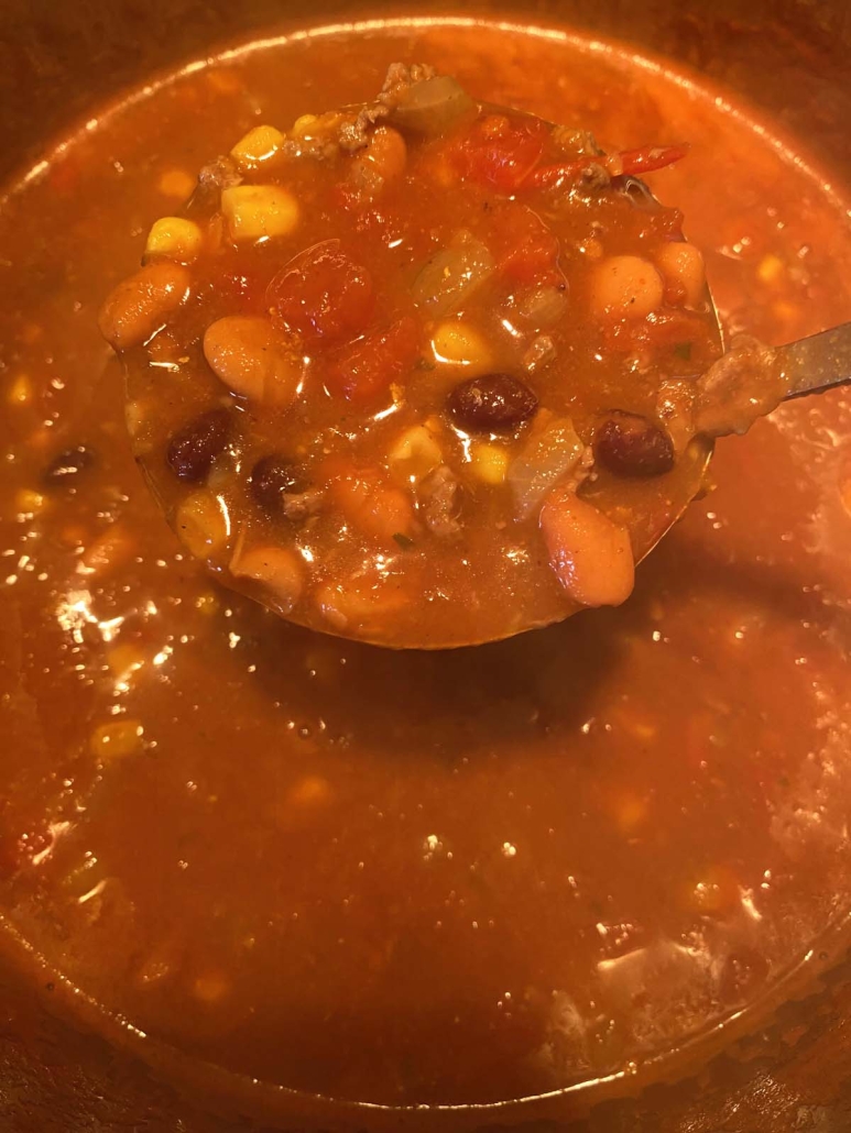 beans, corn, tomatoes, and ground beef in 7 Can Taco Soup