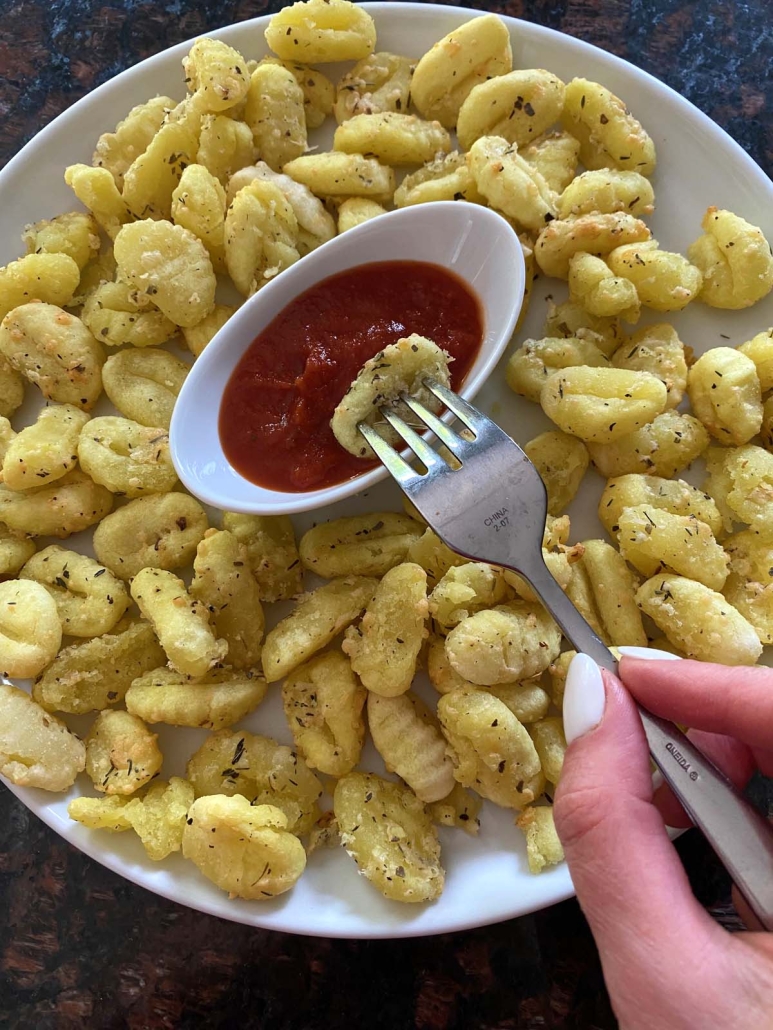 Air Fryer Gnocchi dipped in mariana sauce