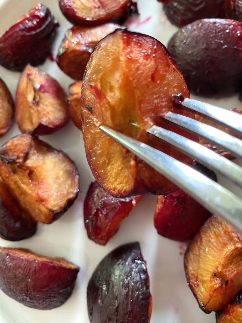 fork holding piece of Roasted Plum