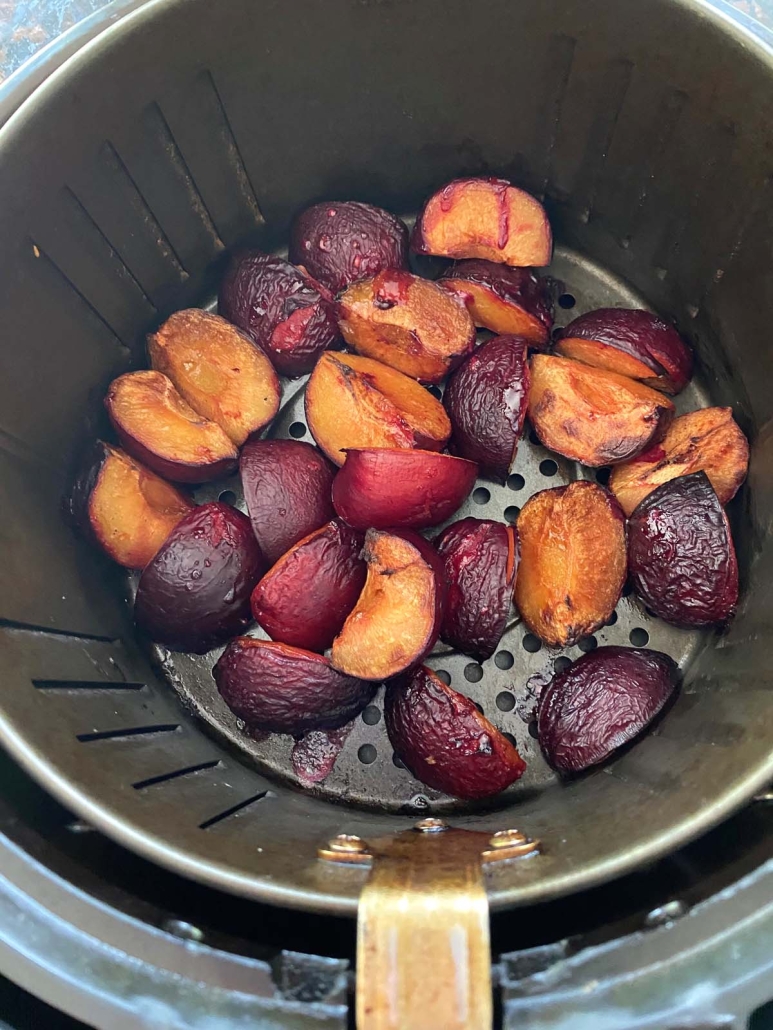 plums sliced into quarters and roasted in the air fryer