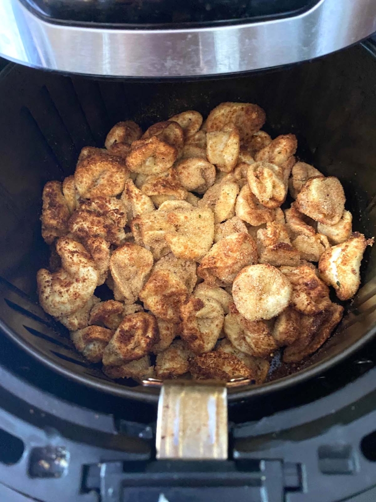 air fryer opened to show Air Fryer Tortellini