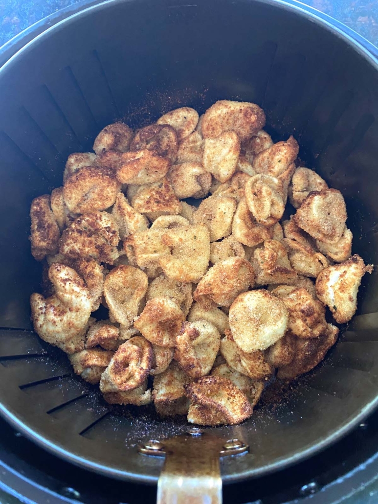 Air Fryer Tortellini crisping up in air fryer basket