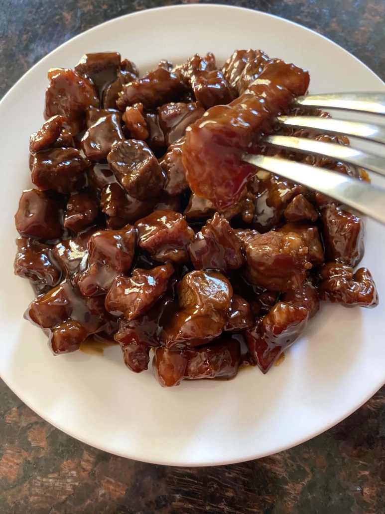 fork holding piece of Beef Teriyaki