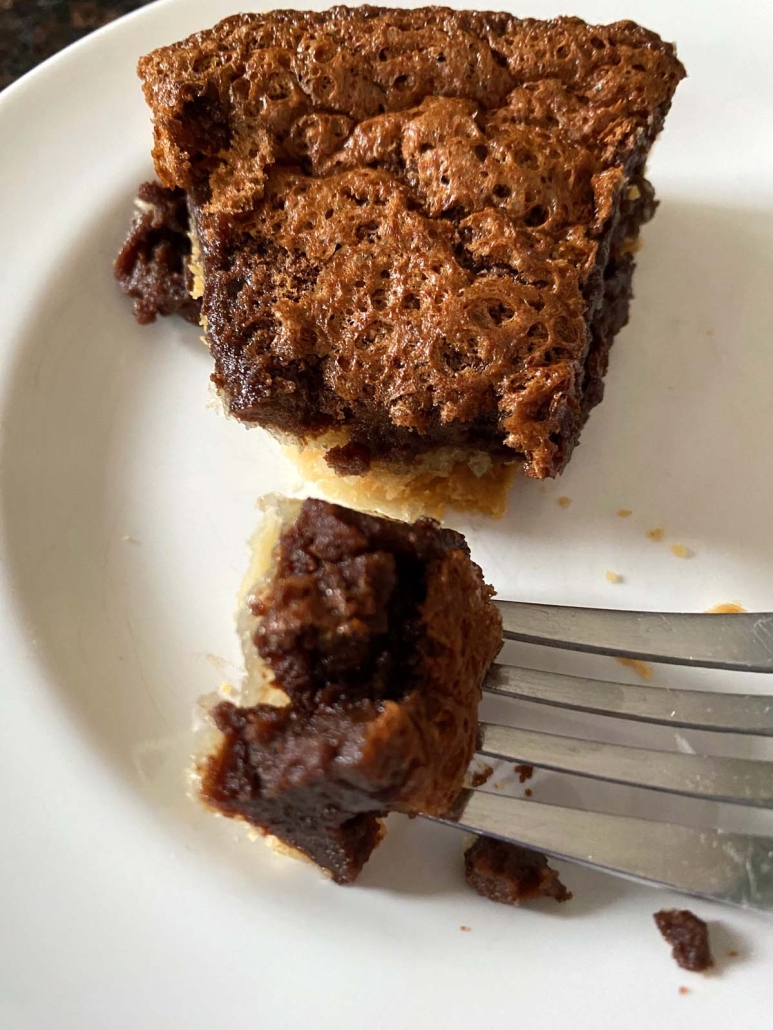 fork holding bite of Chocolate Chess Pie