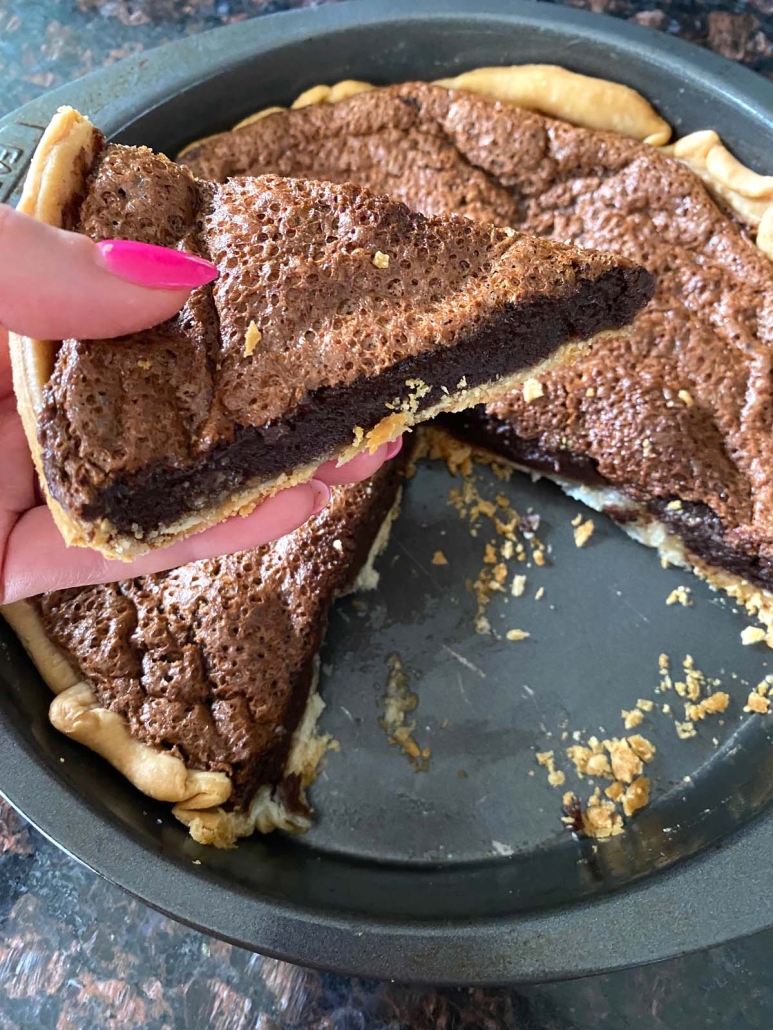 hand holding slice of Chocolate Chess Pie