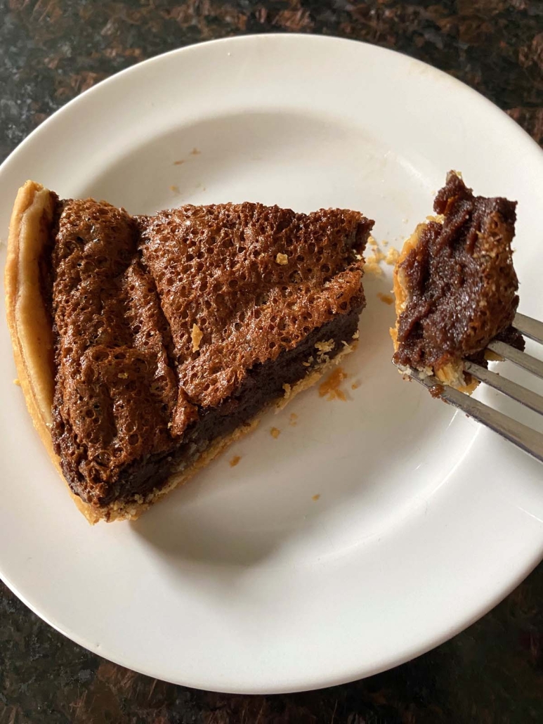slice of Chocolate Chess Pie with fork holding a piece