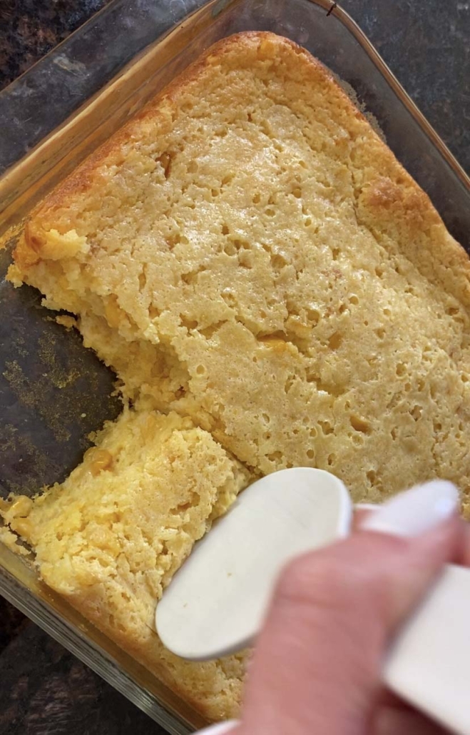 spatula scooping up piece of Cornbread Casserole