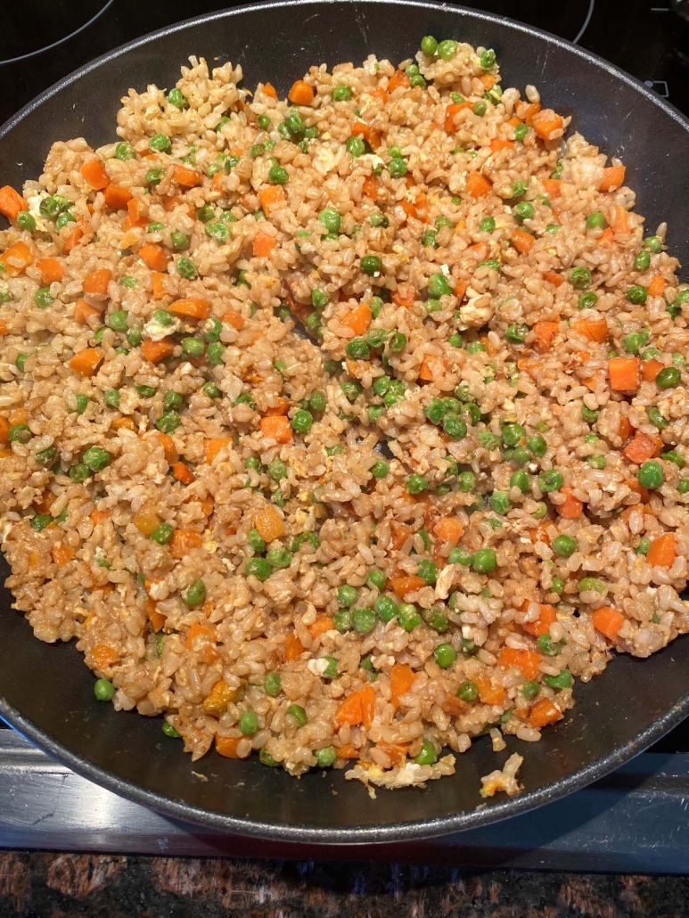 Fried Brown Rice cooking in a skillet