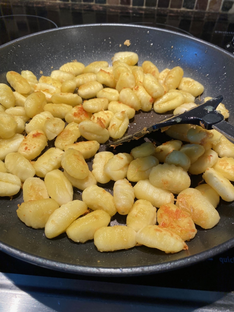 spatula mixing up Pan Fried Gnocchi