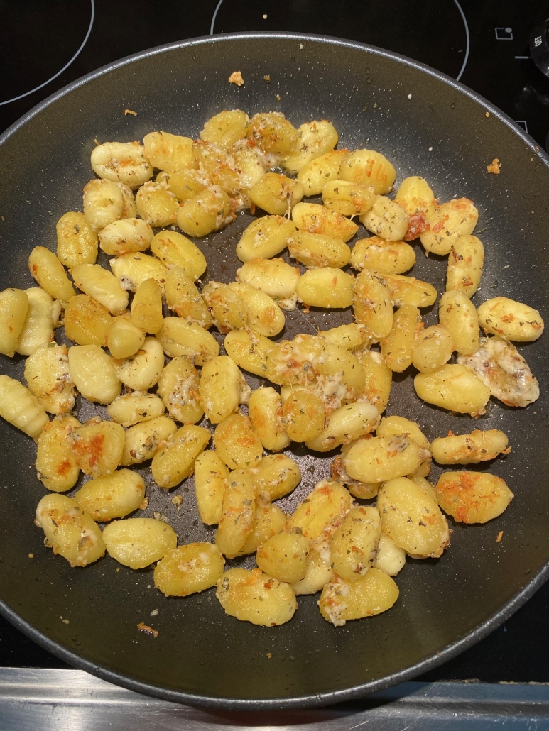 gnocchi frying in a skillet