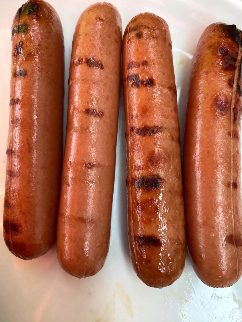 grilled hot dogs on a plate