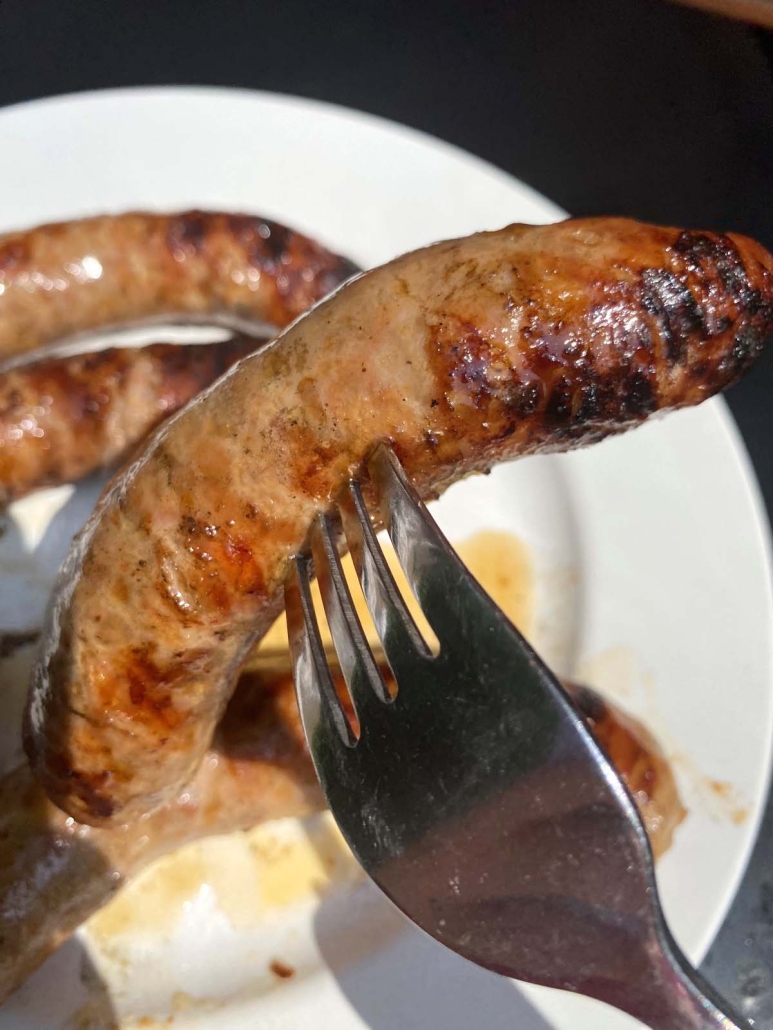 fork holding Grilled Italian Sausage